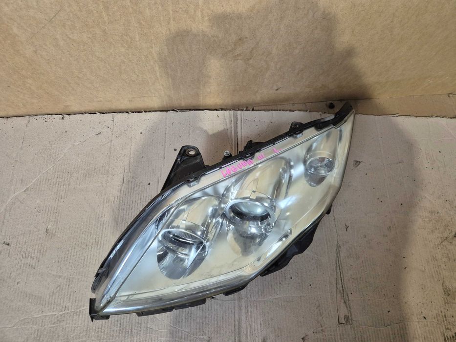 Renault Laguna III lampa przednia lewa przód.