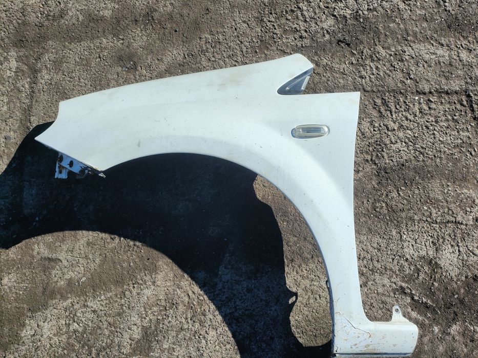 Fiat Grande Punto błotnik lewy przód biały