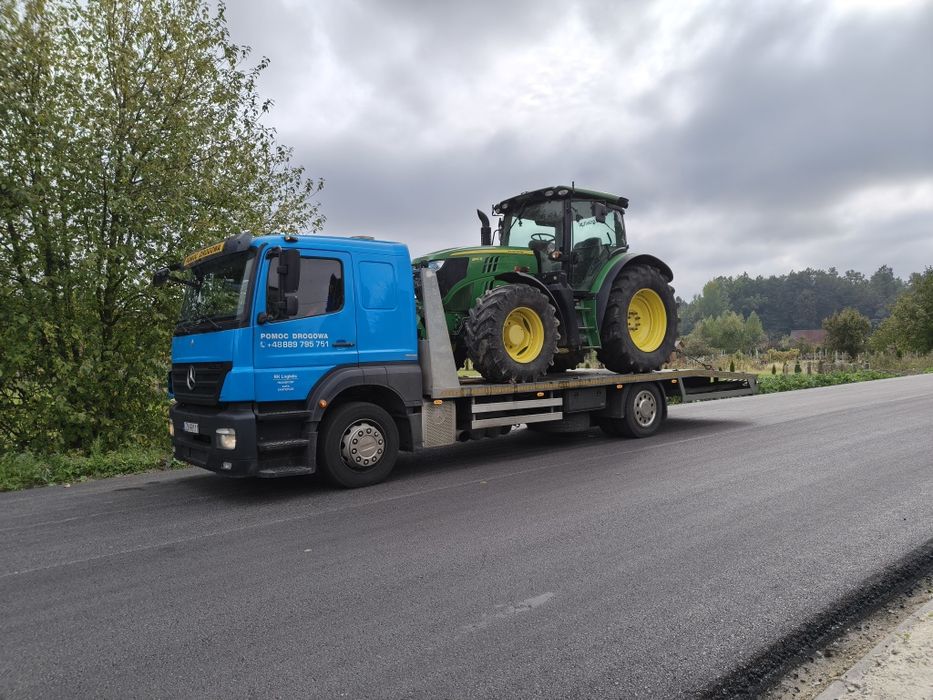 Transport maszyn ciągników holowanie pomoc drogowa  laweta