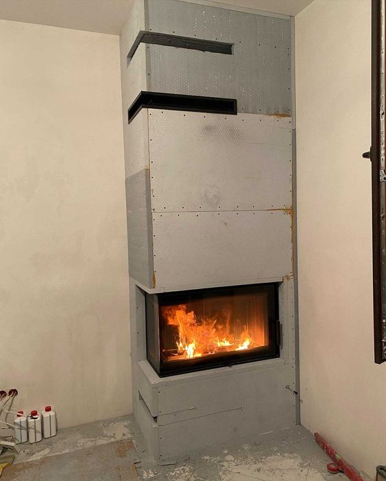 Якісний монтаж каміна з обігрівом на будинок