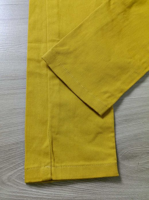 Damskie spodnie jeansy żółte musztardowe rozciągliwe Asos 36