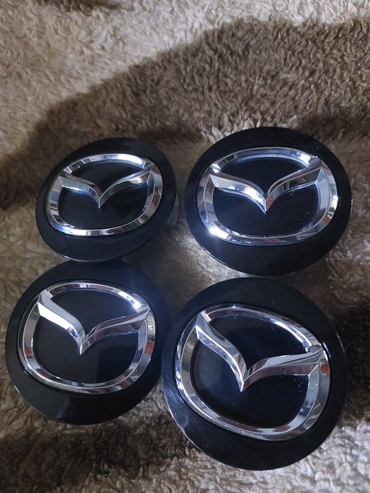 Колпачки заглушки на Мазду