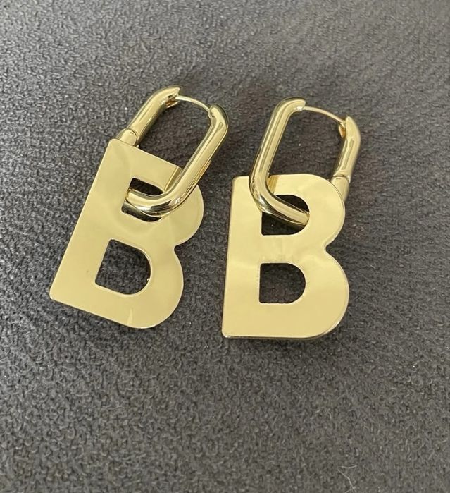 Сережки - трансформери під відомий бренд