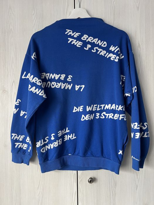 Niebieska bluza Adidas BK5998 NYC Graffiti Crew Sweatshirt