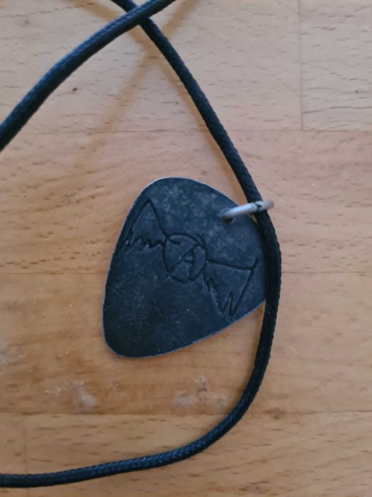 Palheta em Bronze da banda Aerosmith