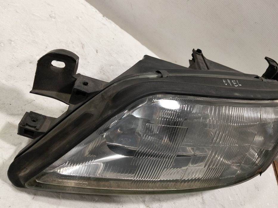 Farol Opel Vectra B ÓTICA esquerdo 1998