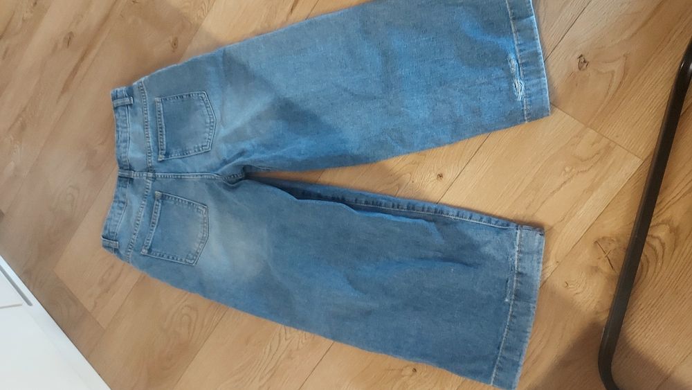 Spodnie jeans szerokie Reseved dziury 146