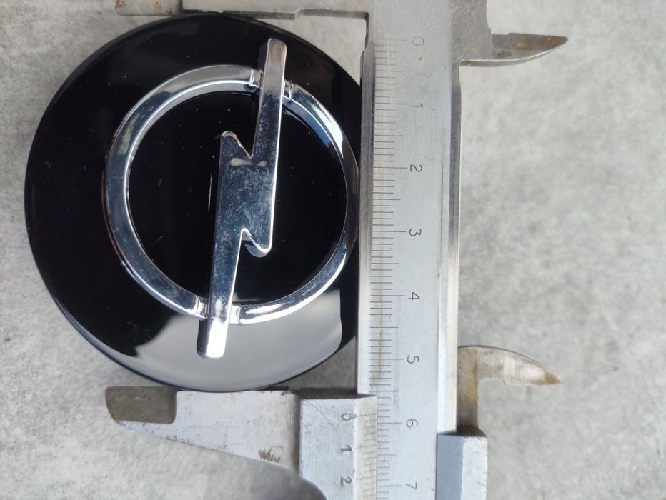 Dekle dekielki opel nowe 58mm / 55mm emblematy logo na alufelgi