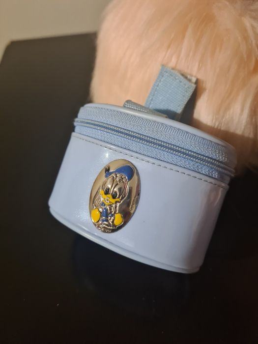 Porta chupeta forrado com emblema em prata434732498346977280
