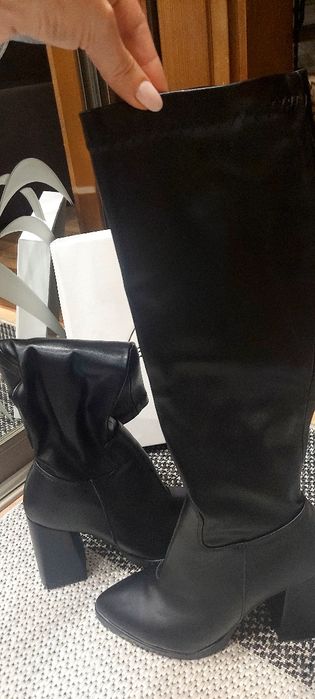 Нові шкіряні чоботи