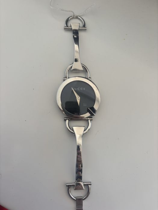 Relógio gucci.