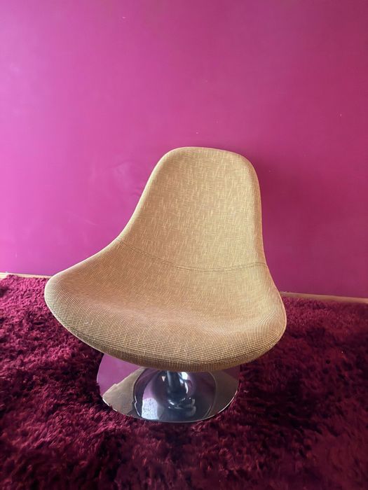 Poltrona verde rotativa