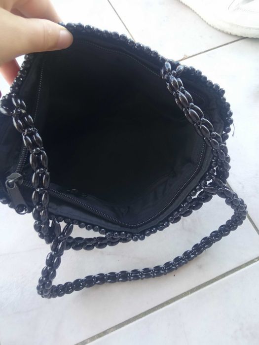Bolsa preta mão