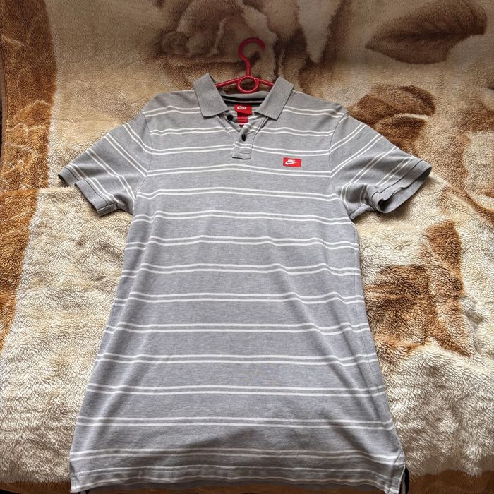 Поло Nike.