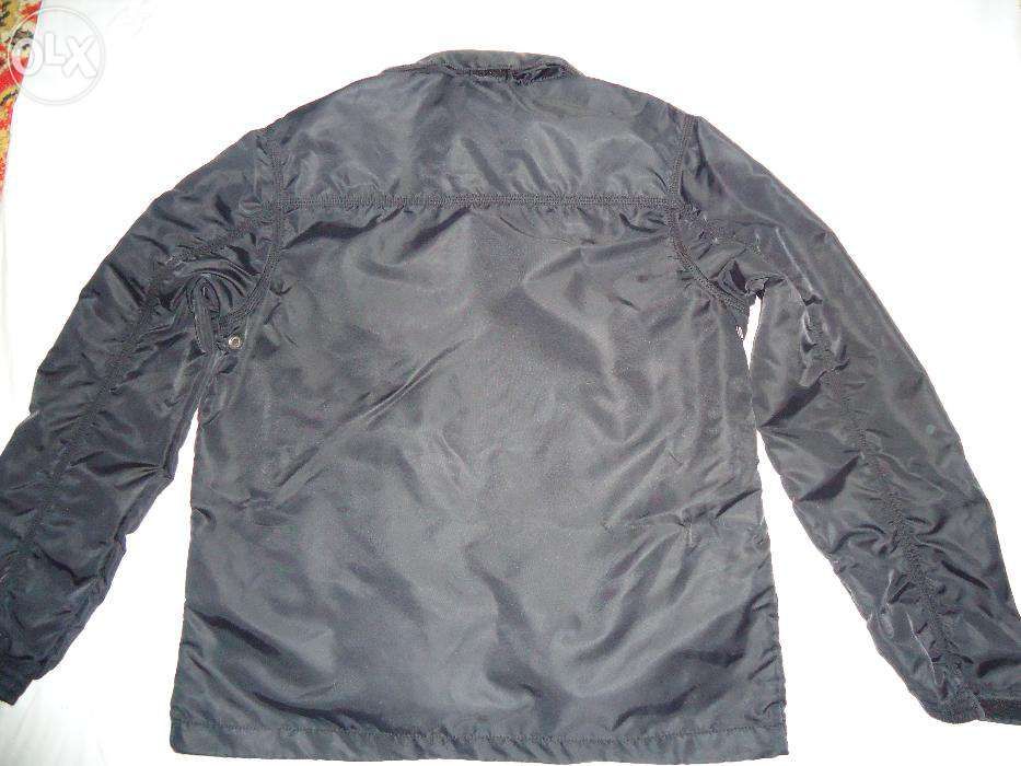 Курточка демисезонная Junker Casual Wear.На замочках компасы.