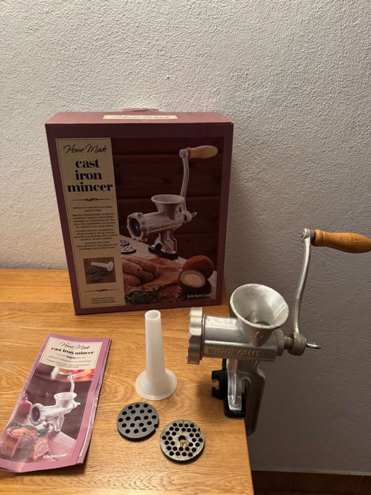 Meat/vegetable mincer or sausage maker.