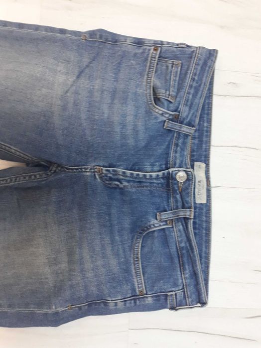 spodnie jeans top shop z dziurami