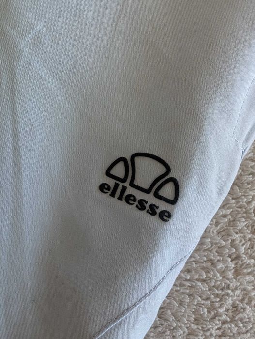 Niebieskie spodnie sportowe dresowe ortalionowe dresy Ellesse 38