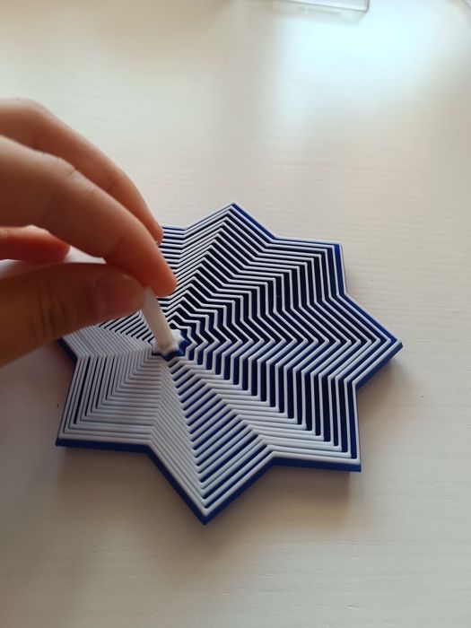 Um brinquedo anti-stress super giro, impresso numa impressora 3D.
