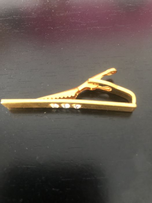 Clip de gravata dourado