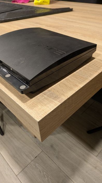 PS3 chipada em caixa