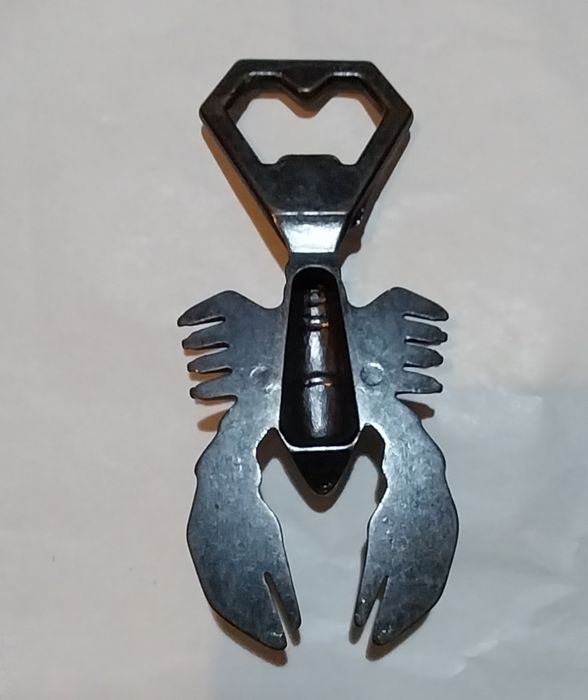 Abre cápsulas antigo em metal