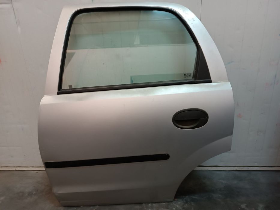 PORTA OPEL CORSA C 01-06 - FRENTE DIREITO / TRAS ESQUERDO