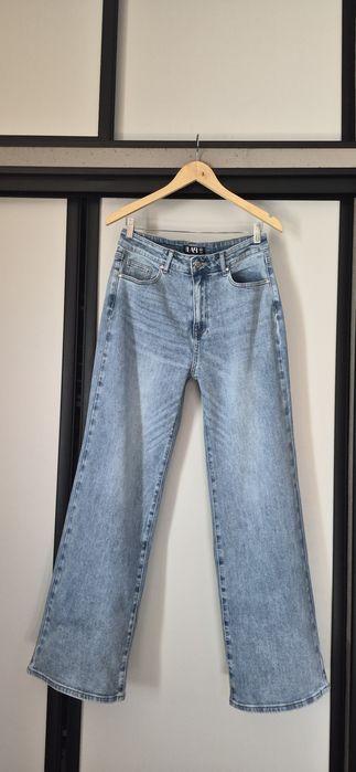 Jasno niebieskie jeansy wide leg XL
