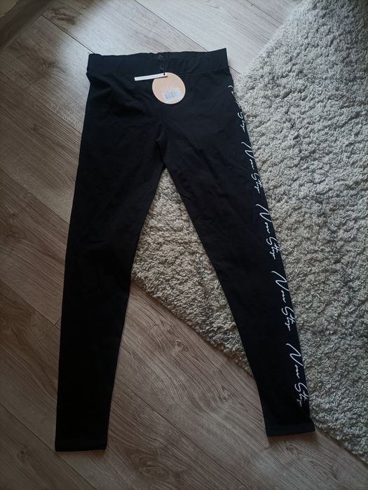 Nowe legginsy damskie z napisem (rozmiar XL)