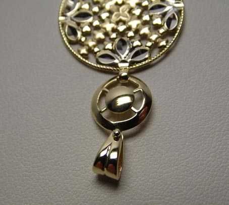 Złota dwukolorowa zawieszka ruchome elementy.