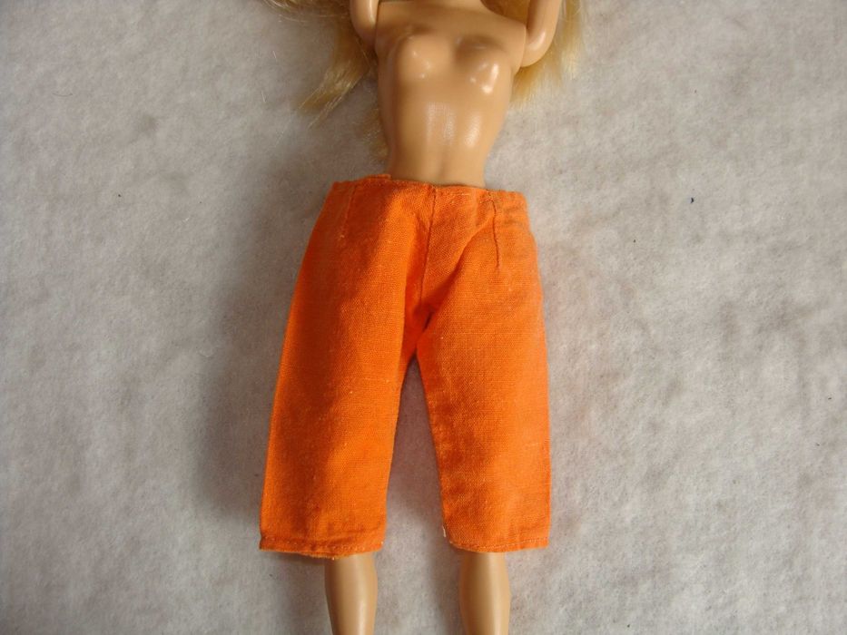 Calças laranja Boneca