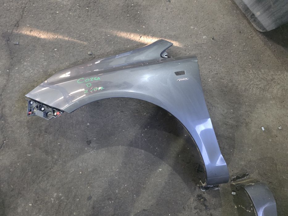 Corsa D Błotnik przód z177