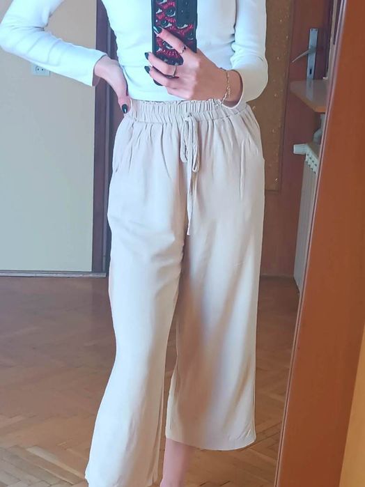 Lniane beżowe spodnie 3/4 7/8 na gumce luźne proste nogawki / XXS 32