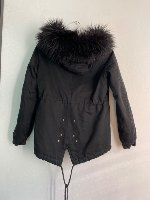 Quispo preto com carapuço