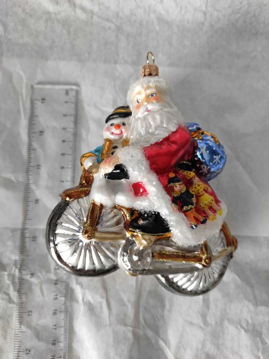 Szklana bombka Huras Family Mikołaj z bałwanem na rowerze