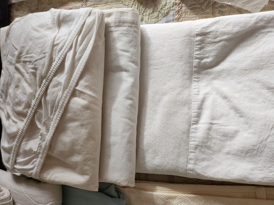 Roupa de cama, toalhas e tapetes