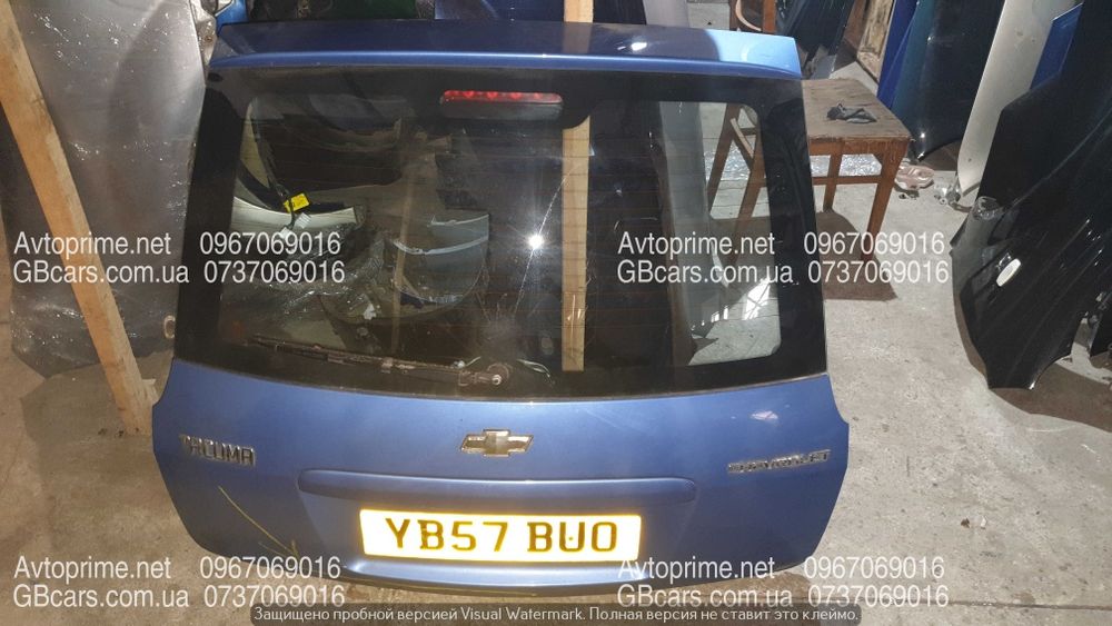 Комплект кришка багажніка ліхтар бампер задній Шевроле такума ta