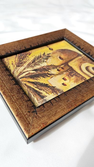 Obraz malowany na płótnie oprawiony w drewnianej zdobionej ramce