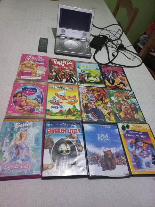 DVD para filmes com comando, carregador e 12 filmes incluidos Tudo=25€