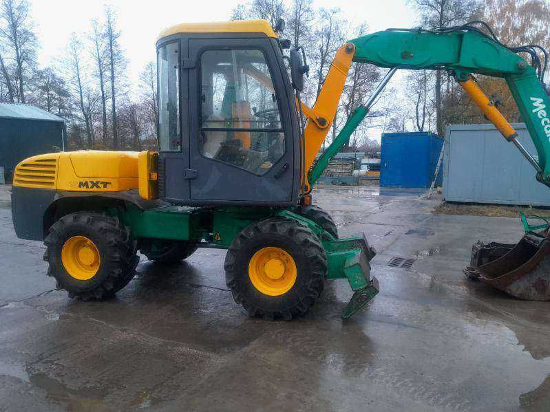 Koparka kołowa MECALAC 12 MXT, 4x4 + zestaw łyżek SILNIK PO REMONCIE