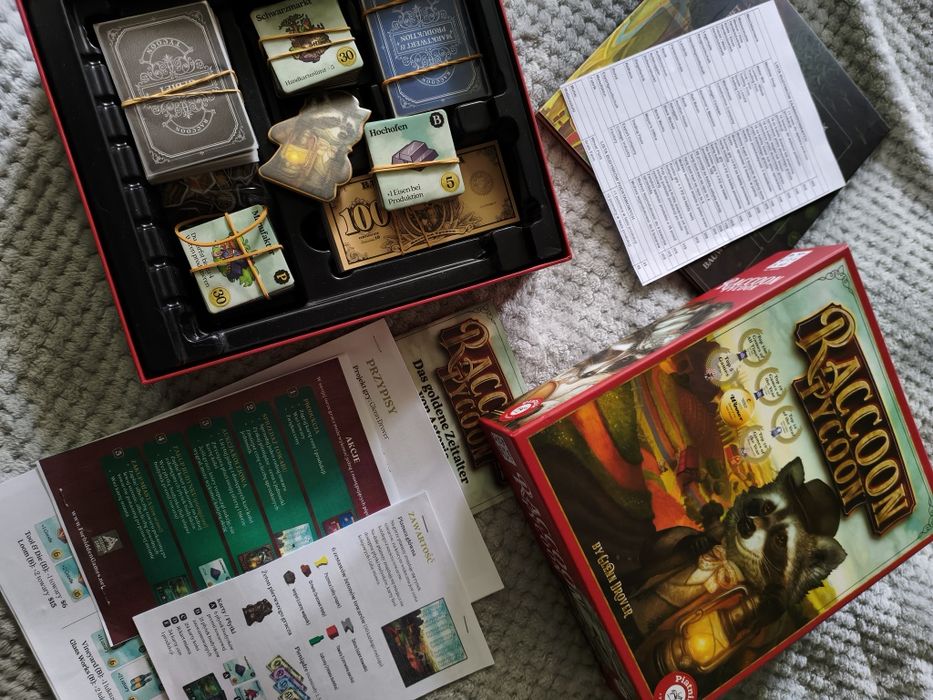 Raccoon Tycoon gra planszowa (DE) + PL instrukcja i karty pomocy. Stan idealny