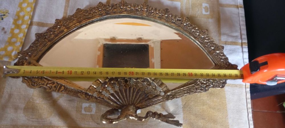 espelho de entrada em forma de leque em bronze fundido