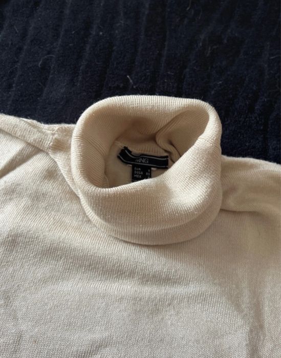 Camisola de gola alta sem mangas