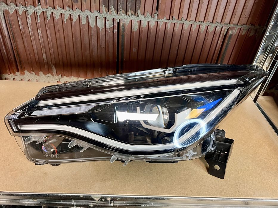 Renault Zeo lift lampa reflektor lewy