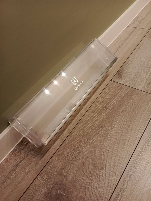 Półka z klapką Electrolux na drzwi lodówki