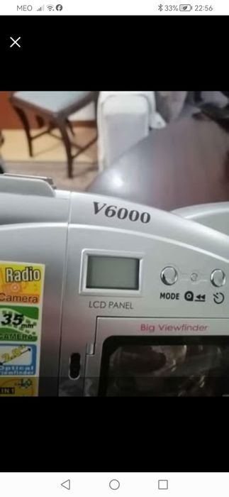 Câmara de filmar da marca Olympia + telefone fixo.