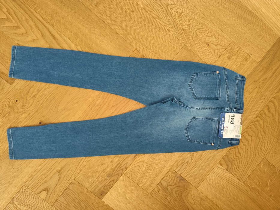 Nowe jeansy dziewczęce skinny fit 158 niebieskie