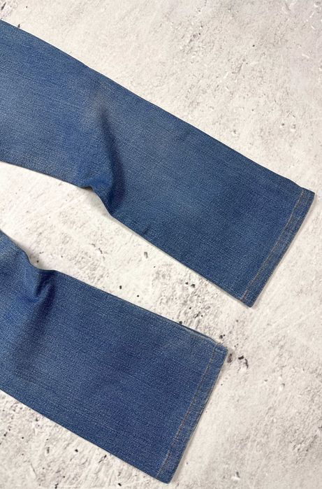 Spodnie jeansowe LEVIS 553 Mid-Rise Boot dzwony damskie szerokie W29