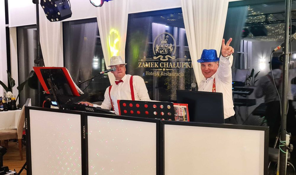 Oprawa muzyczna DJ + wodzirej lub Zespół muzyczny.