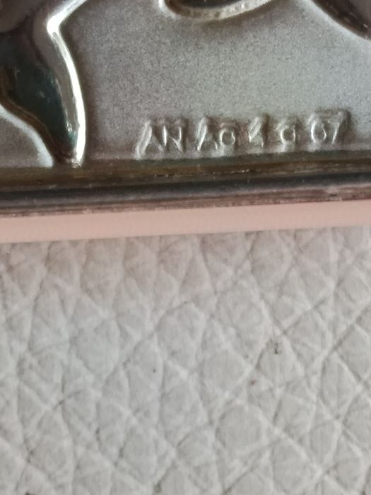 Silver mat board with dolphin motif.64738403931266123